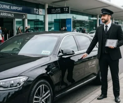 melbourne airport transfers luxury chauffeur open the door of car.