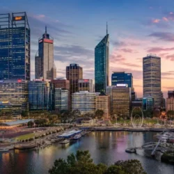 Perth CBD skyline at sunset with waterfront and city buildings