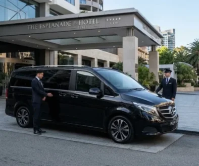 Sleek black Mercedes-Benz V-Class luxury chauffeur vehicle parked outside a high-end corporate hotel in Perth.